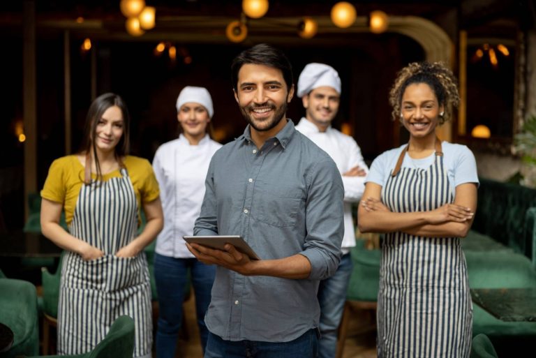 Professional waitstaff smiling Professional waitstaff smiling